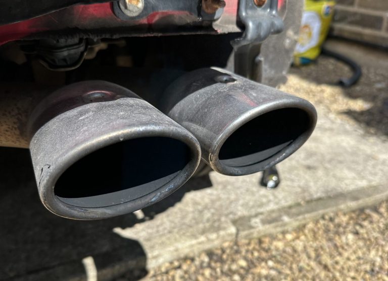 Before picture of a dual exhaust system on a car