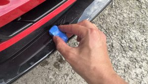 Clay barring a front diffuser on a car