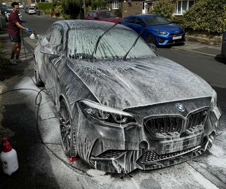 BMW M2 covered in snow foam