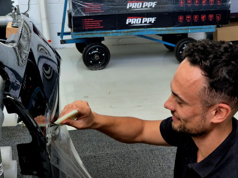 Tom from North Detailing applying PPF to a panel