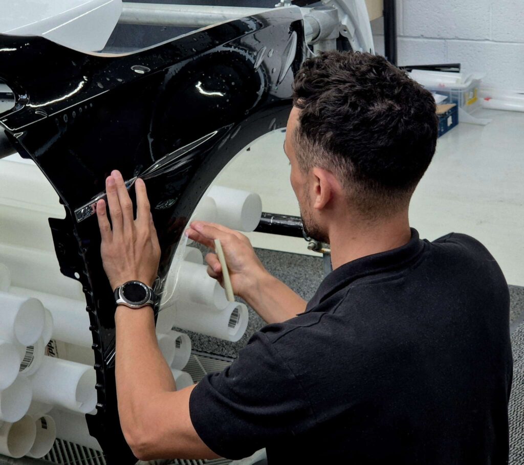 Tom installing PPF on a front Quarter panel
